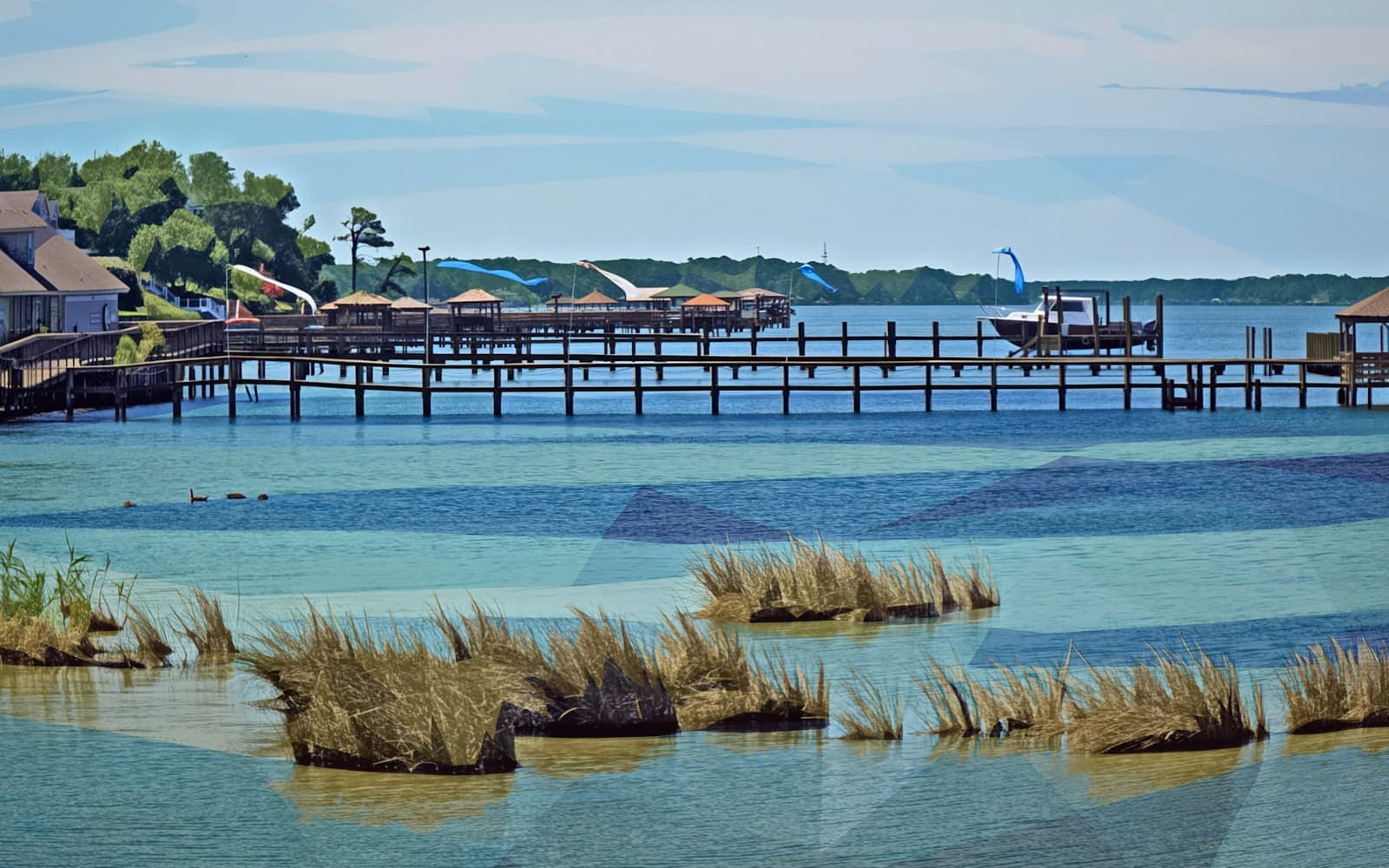 Wooden piers and marsh grass along a coastal river