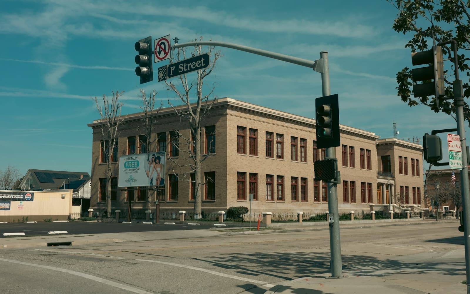 A brick building on a downtown street corner