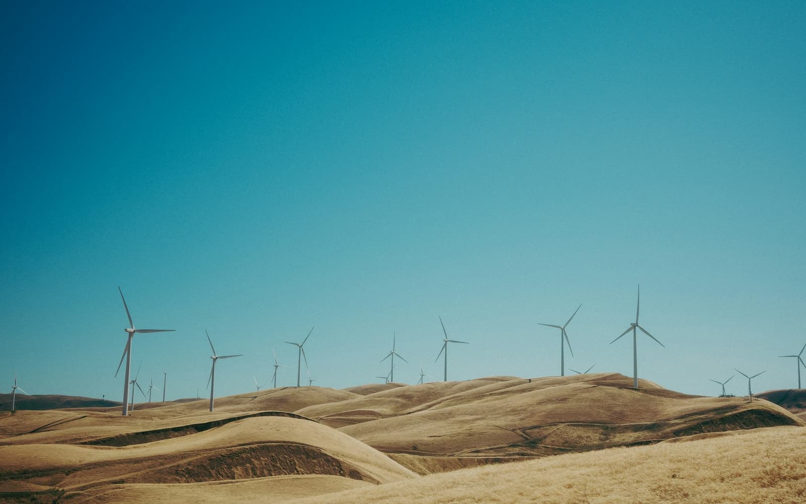 Wind turbines on dry rolling hills