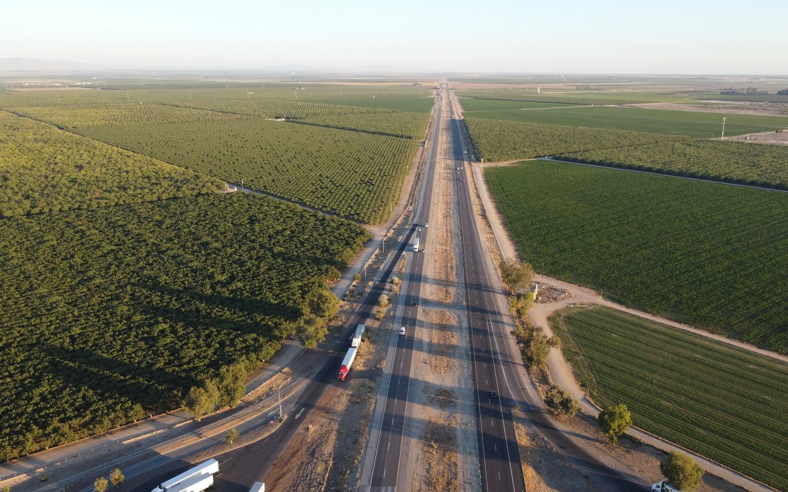 A highway running through farm fields, seen from the air